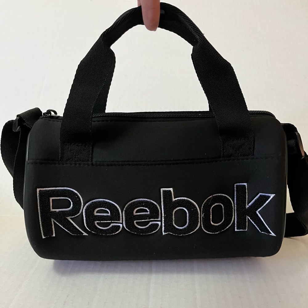 Reebok woman’s oval circular crossbody bag purse